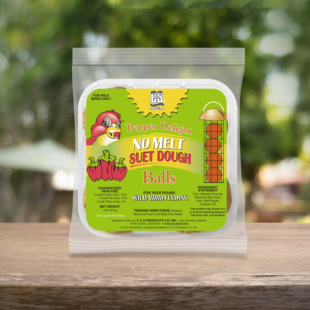 Up close shot of Hot Pepper Delight no melt suet dough  balls sitting on a wooden table