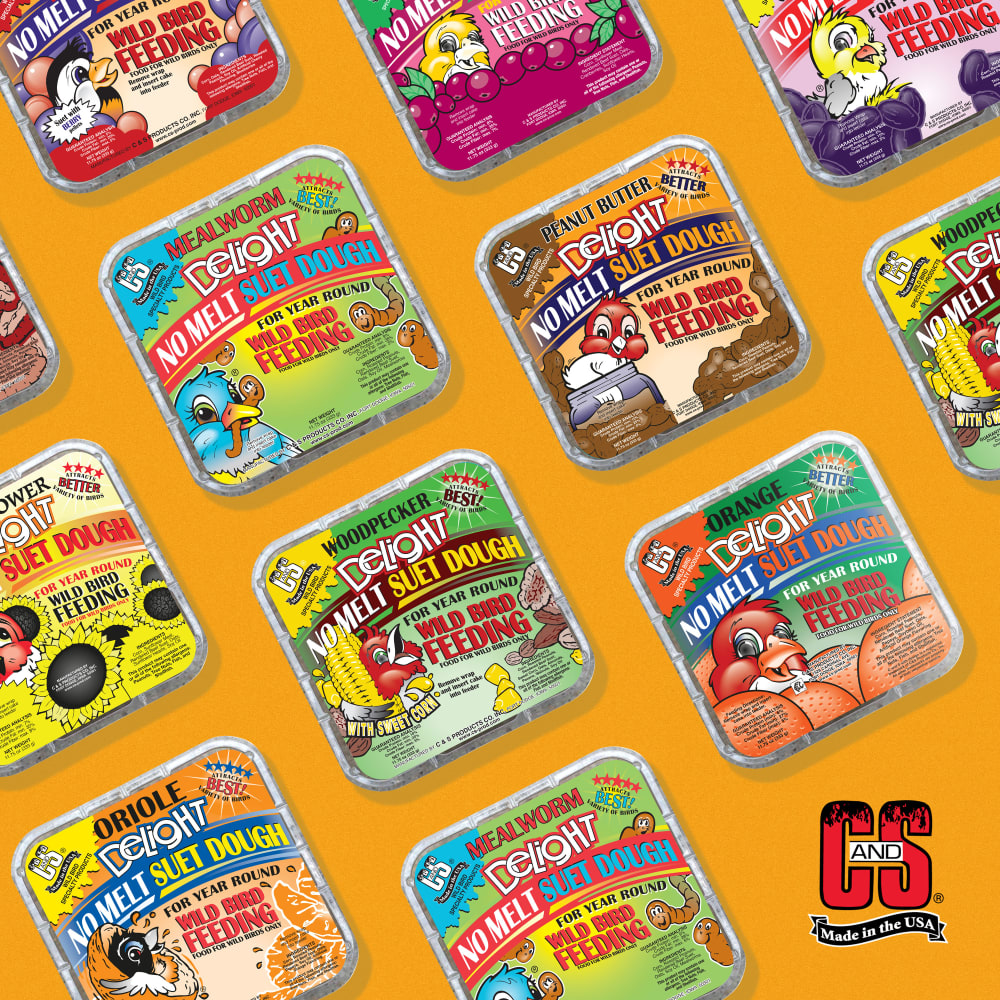 Image of several varieties of suet dough displayed on a green background