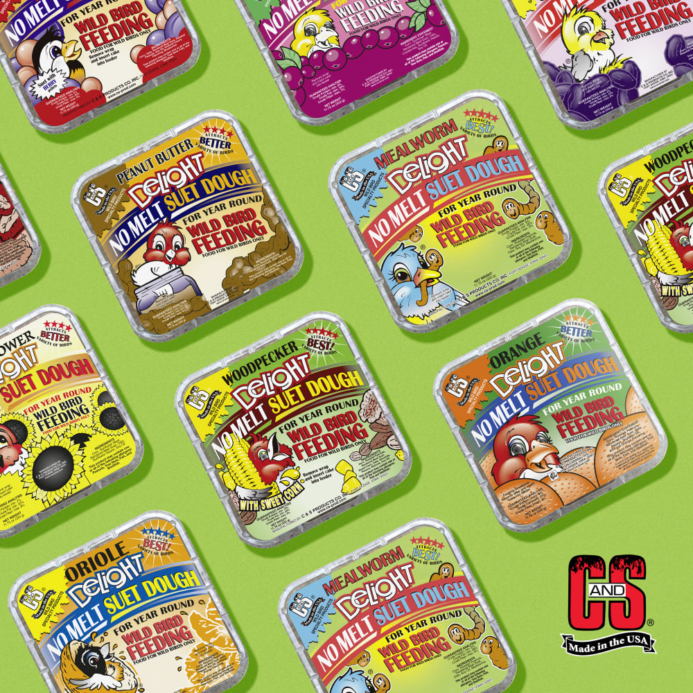 Image of no melt suet dough in several different flavors displayed on a green background